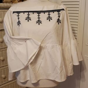 White shirt with blue embroidery